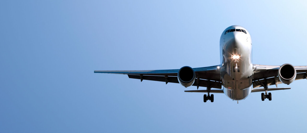 jet airplane landing in blue sky